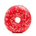 Donut with sprinkles on white background. Pink donut isolated on white background