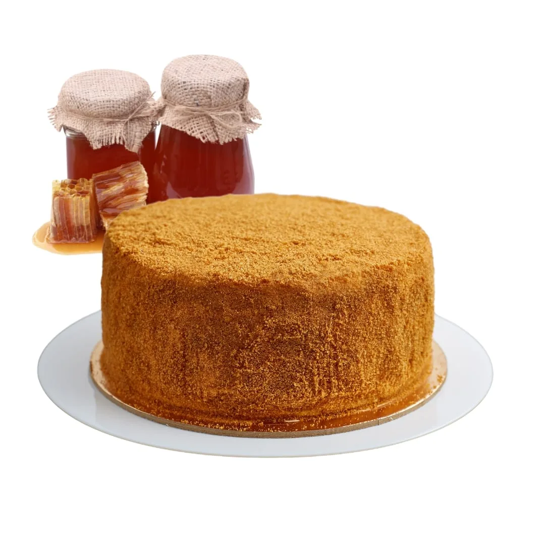 a cake on a plate with jars of jam