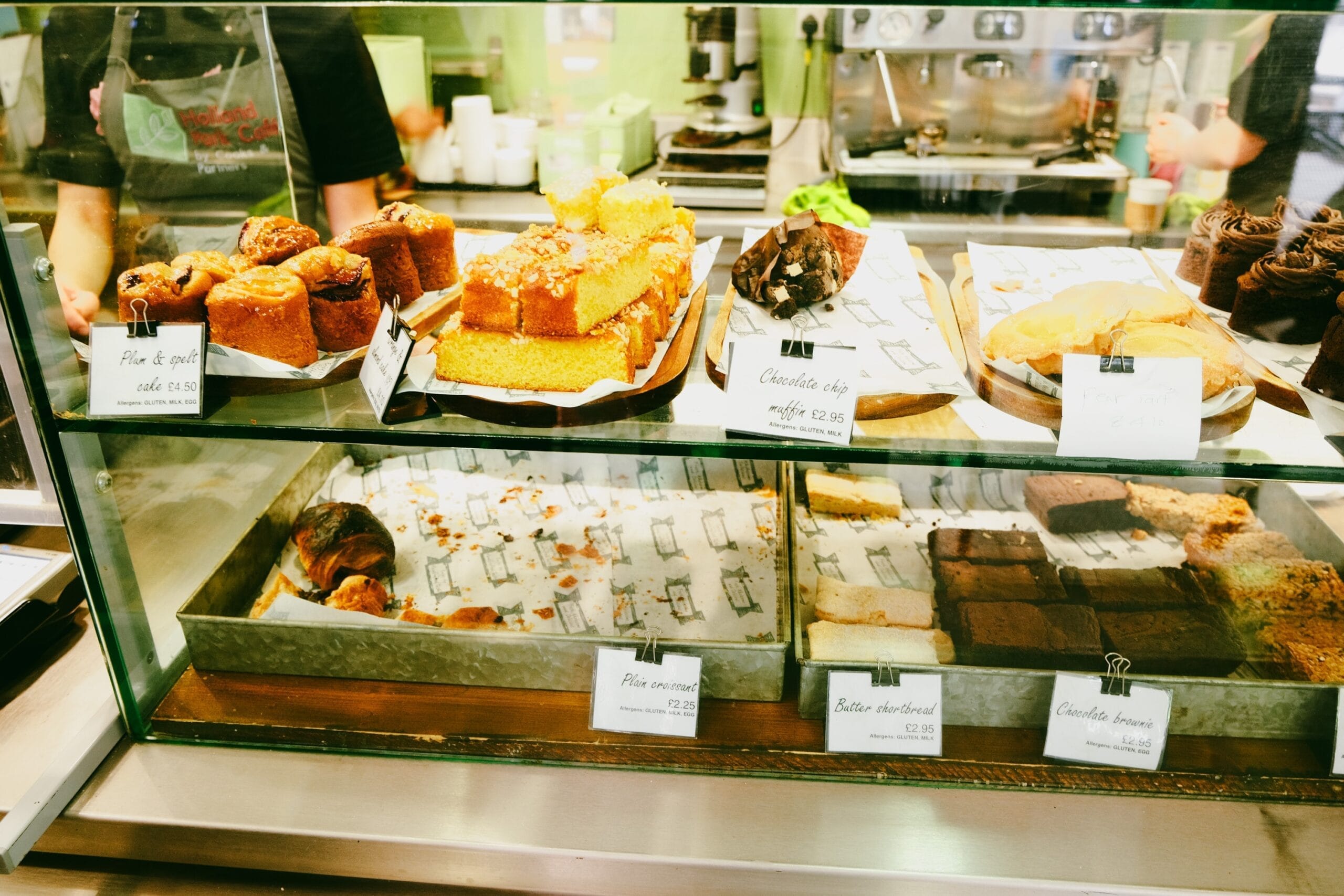 A display case filled with lots of different types of pastries